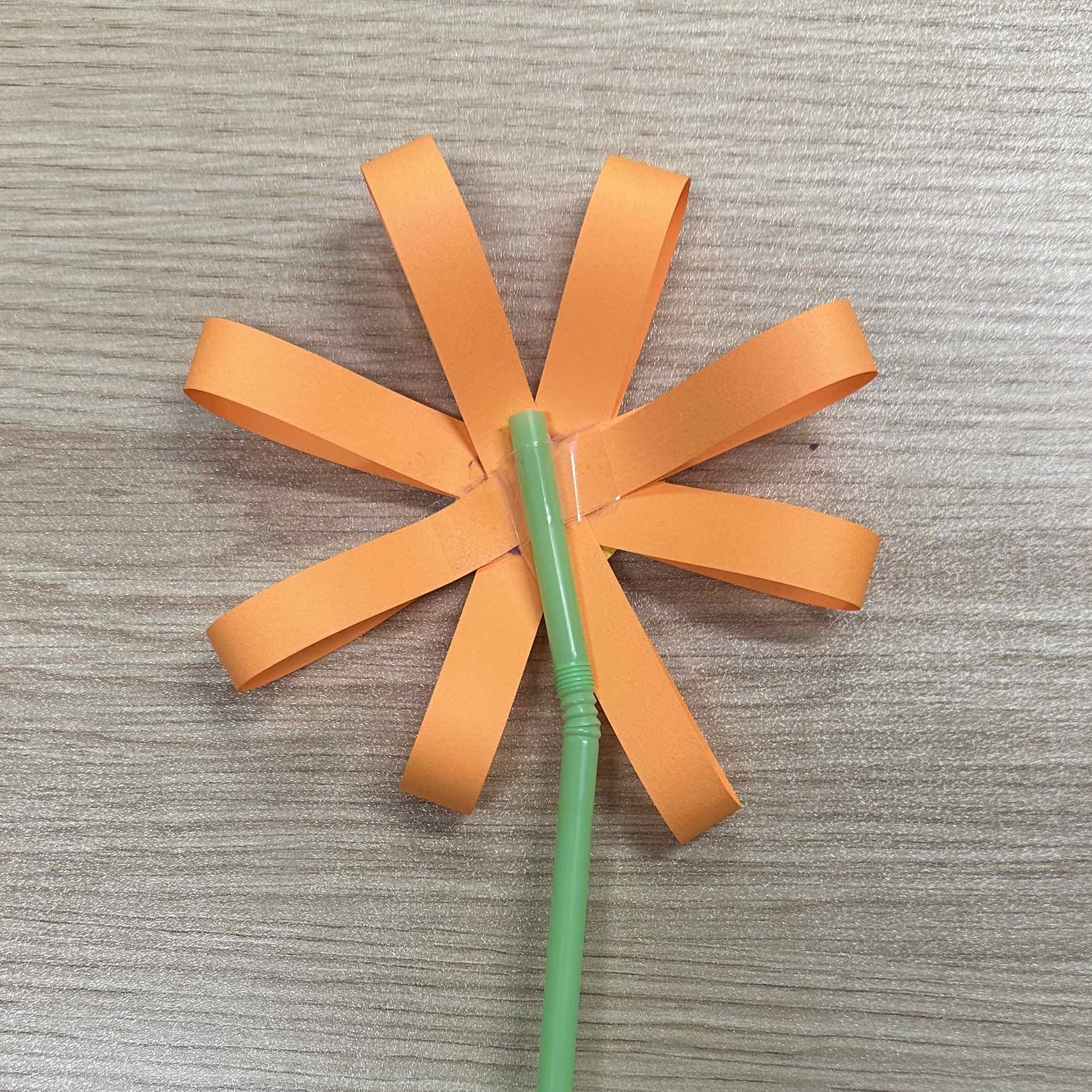 taping straw to the back of flower photo of step 3, taping straw to the back of flower