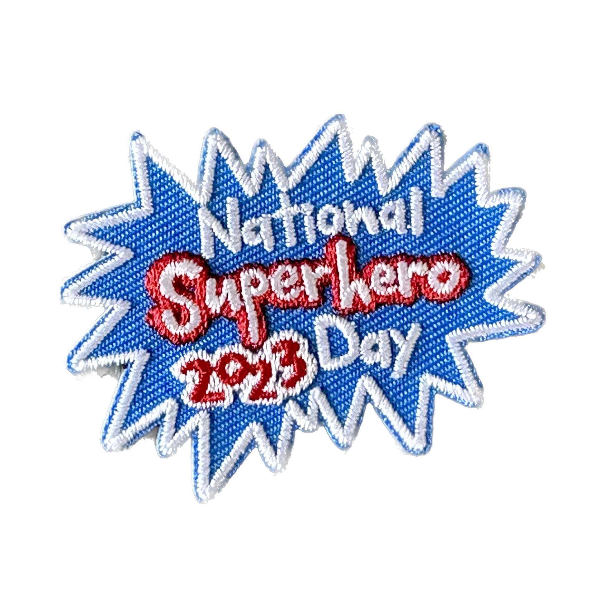 image of patch - blue burst with National Superhero Day 2023 inside